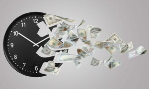 Crumbling clock with flying dollar banknotes on grey background